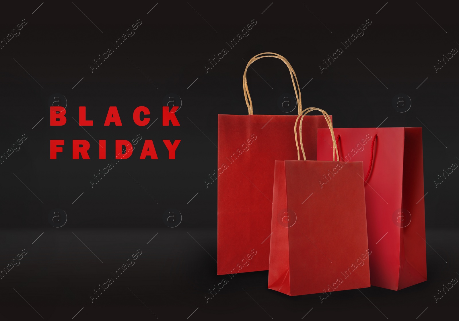 Image of Paper shopping bags on color background. Black friday