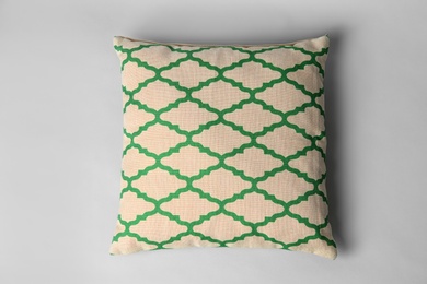 Photo of Soft decorative pillow on light background