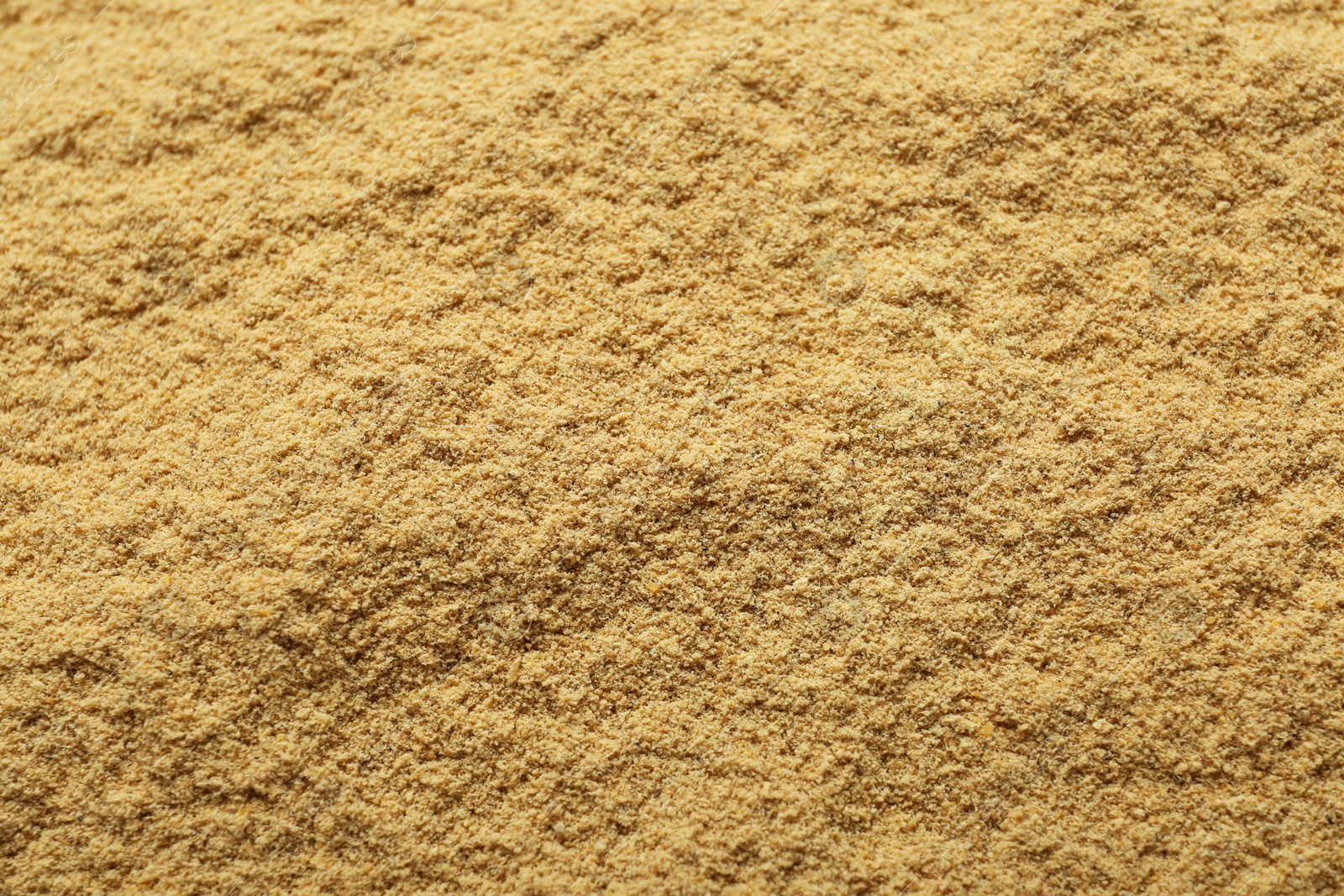 Photo of Aromatic mustard powder as background, top view