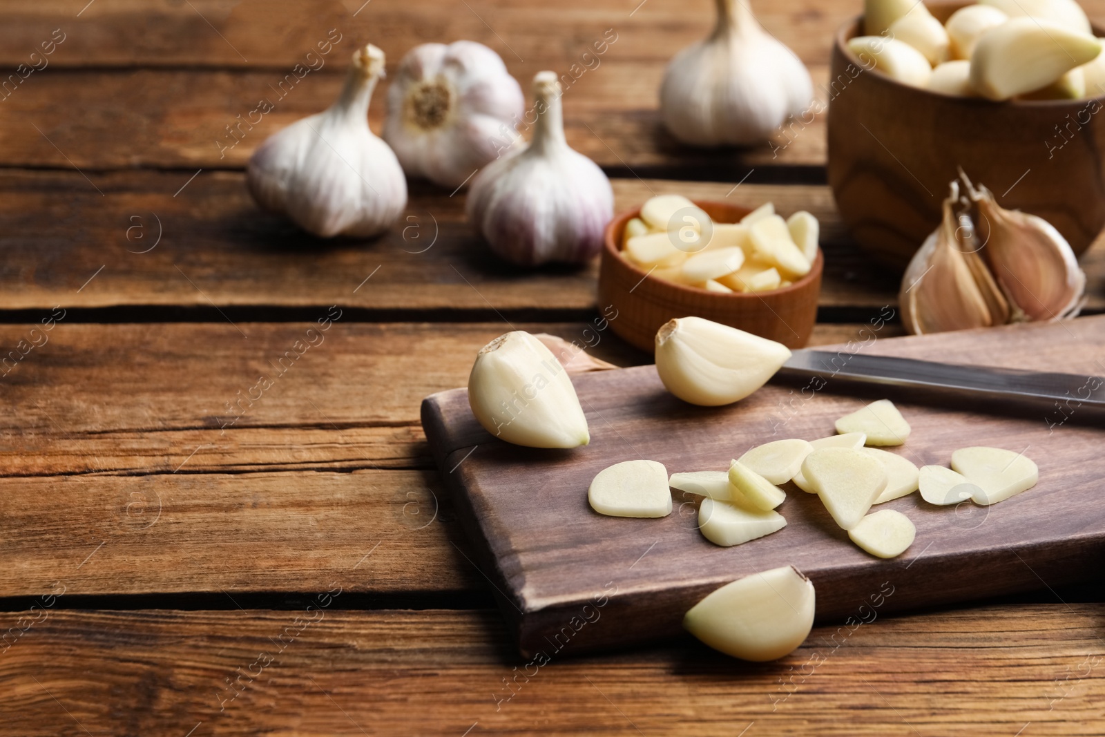 Photo of Fresh garlic on wooden table. Organic product