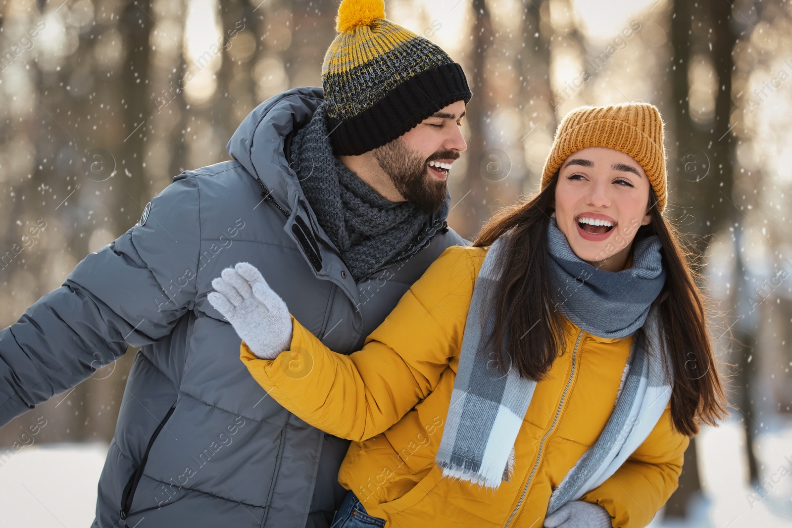 Photo of Happy young couple having fun outdoors on winter day