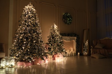 Festive room interior with beautiful Christmas trees