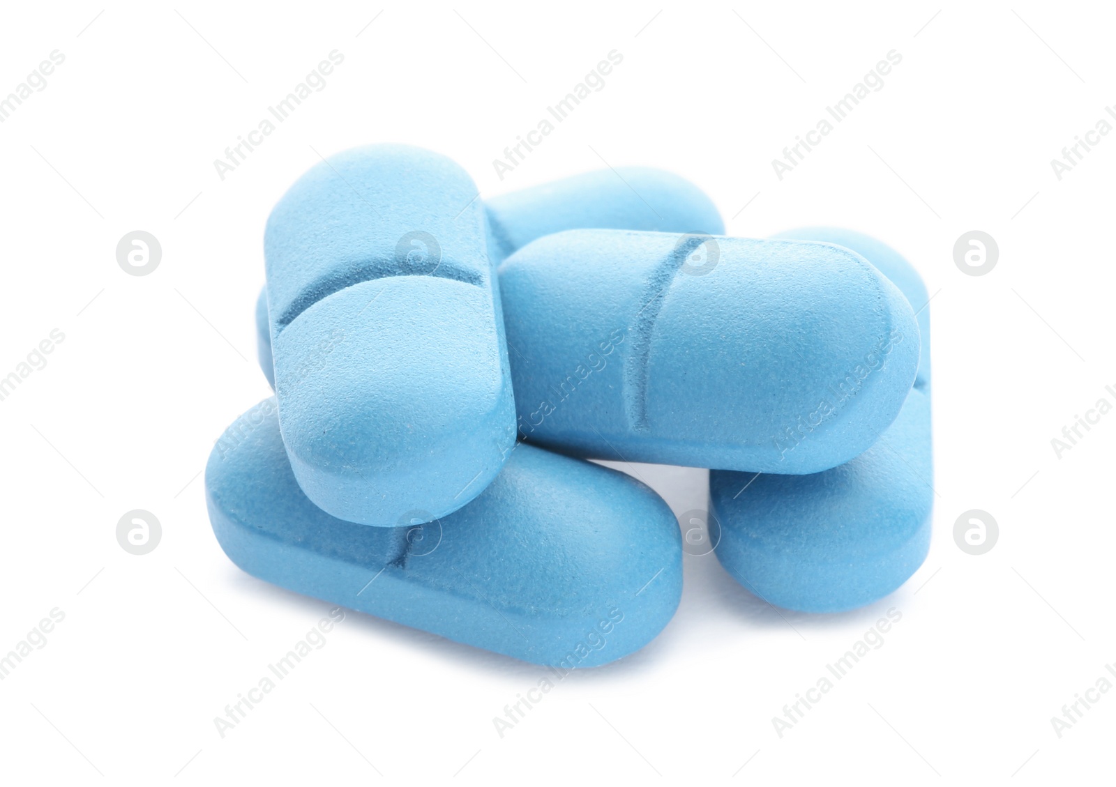 Photo of Pile of color pills on white background