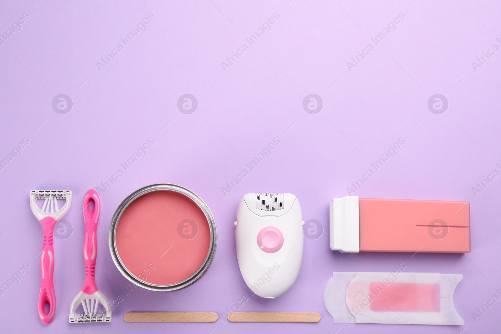 Photo of Set of epilation products on lilac background, flat lay. Space for text