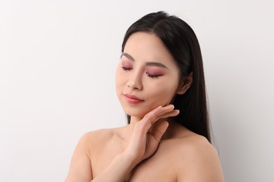 Portrait of beautiful woman on white background