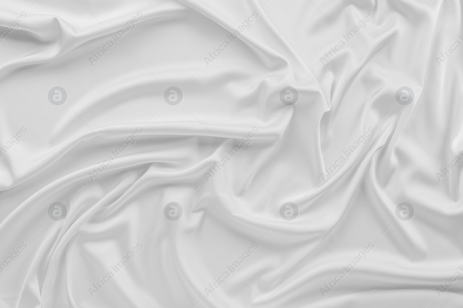 Photo of Texture of white silk ripple fabric as background, top view