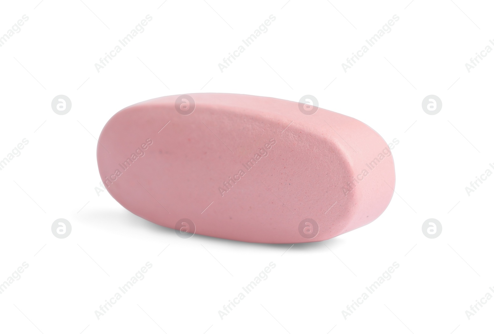 Photo of One pink pill on white background. Medicinal treatment