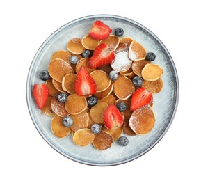 Photo of Plate with cereal pancakes and berries isolated on white, top view