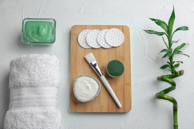 Photo of Flat lay composition with spirulina facial mask and ingredients on white table