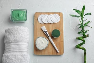 Flat lay composition with spirulina facial mask and ingredients on white table