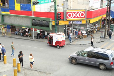 Photo of San Pedro Garza García, Mexico – September 15, 2022: Beautiful cityscape with people and cars on street