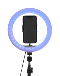 Photo of Tripod with ring light and smartphone isolated on white