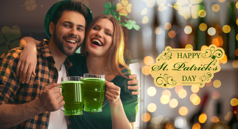 Image of Young man and woman toasting with green beer in pub. St. Patrick's Day celebration