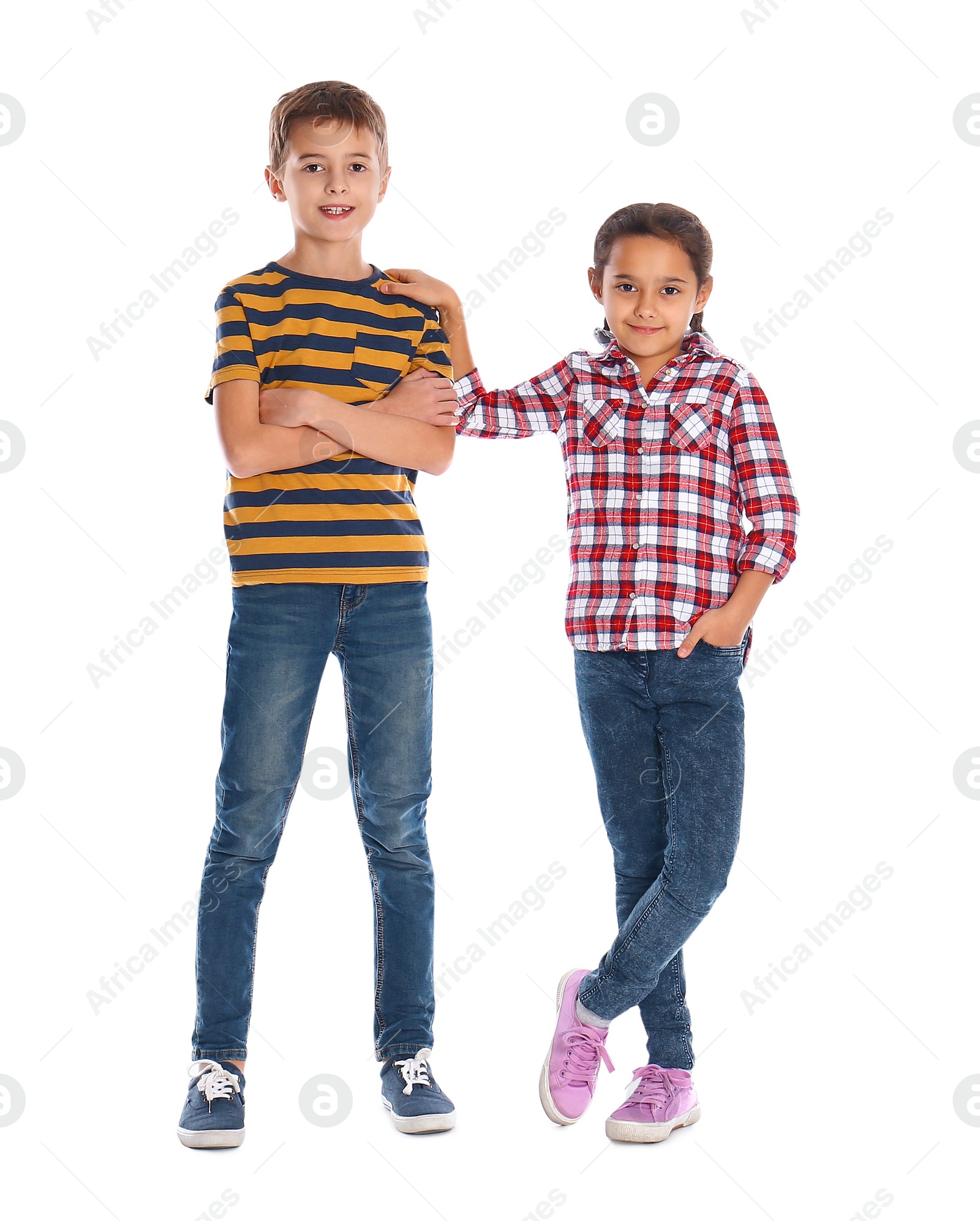 Photo of Cute little children posing on white background