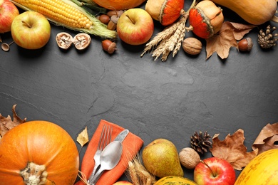 Flat lay composition with cutlery, autumn vegetables and fruits on grey background, space for text. Happy Thanksgiving day