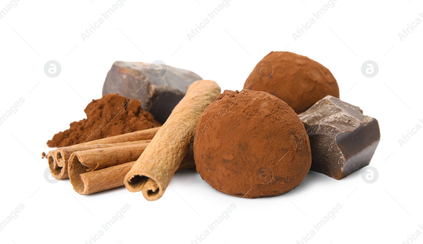 Photo of Delicious chocolate truffles with ingredients on white background