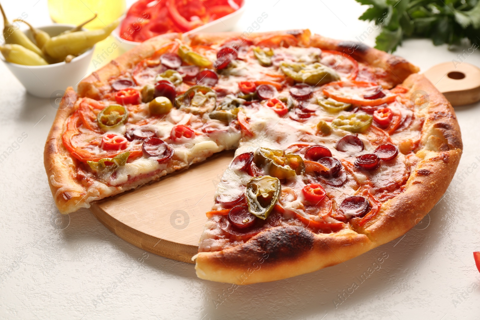 Photo of Delicious pizza Diablo on white textured table, closeup