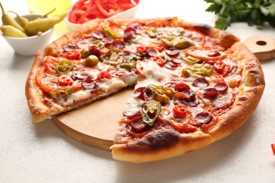 Photo of Delicious pizza Diablo on white textured table, closeup