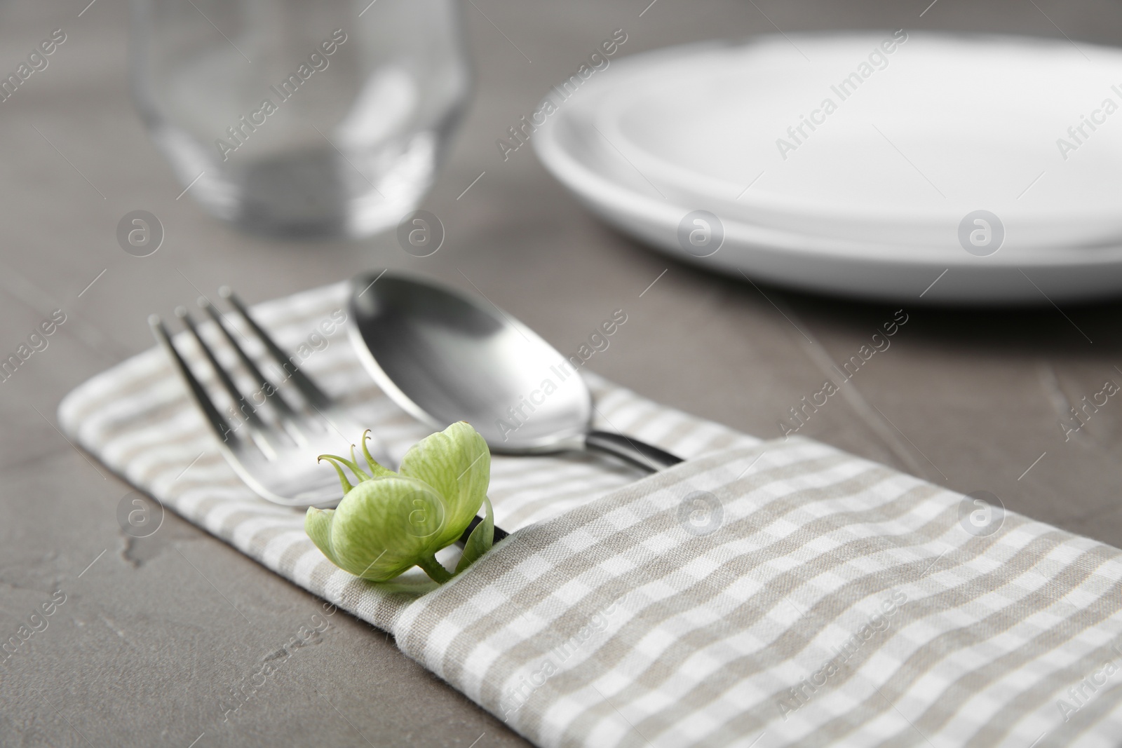 Photo of Beautiful table setting on grey background, closeup