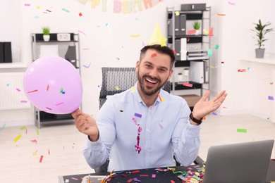 Photo of Man having fun during office party at workplace