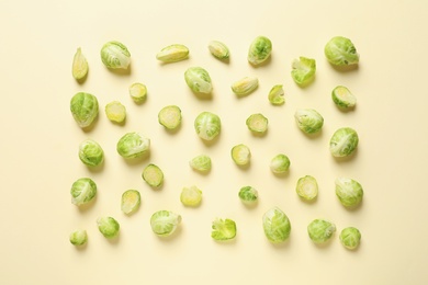 Photo of Fresh Brussels sprouts on color background, flat lay