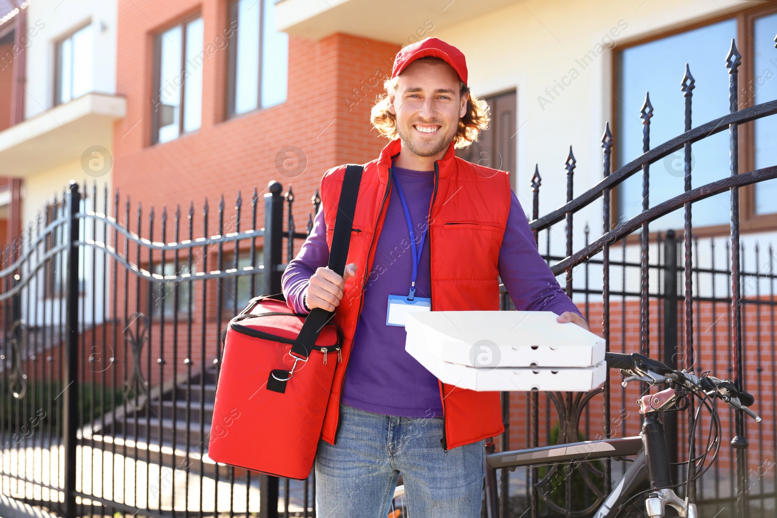 Photo of Male courier delivering food in city on sunny day