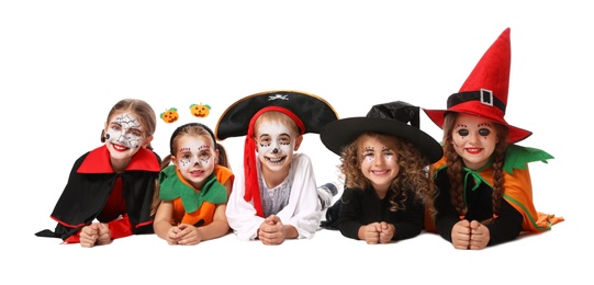 Photo of Cute little kids wearing Halloween costumes on white background