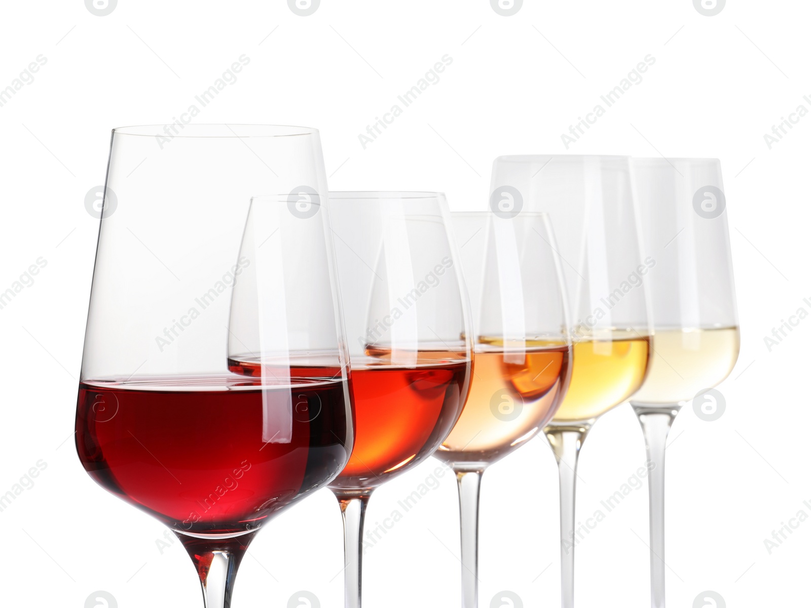 Photo of Row of glasses with different wines on white background