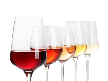 Photo of Row of glasses with different wines on white background