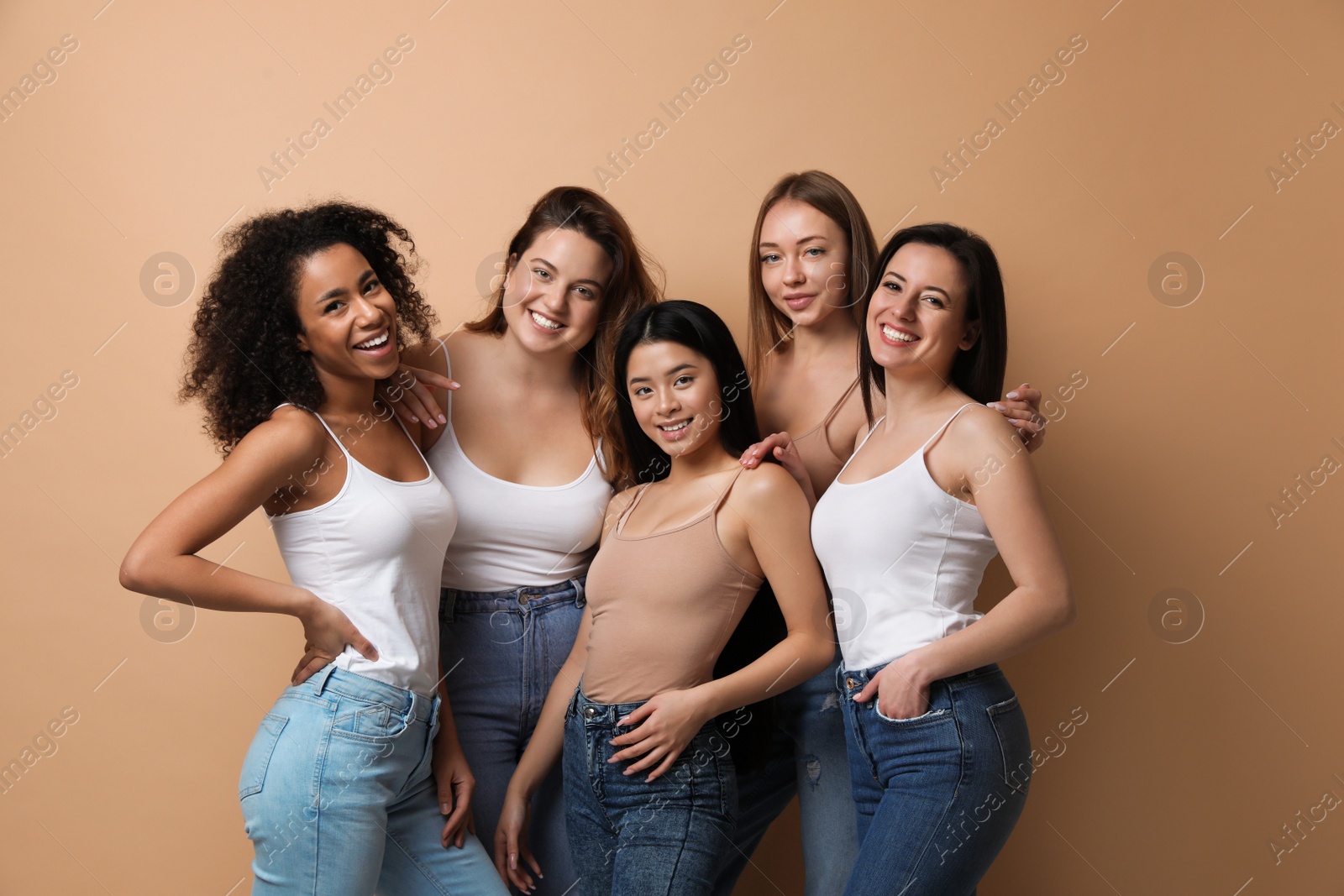 Photo of Group of women with different body types on beige background