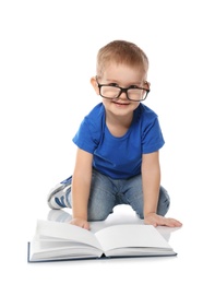 Photo of Little child with eyeglasses and book on white background