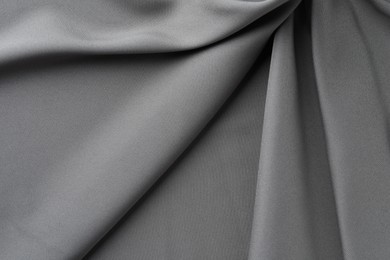 Photo of Texture of grey crumpled silk fabric as background, top view