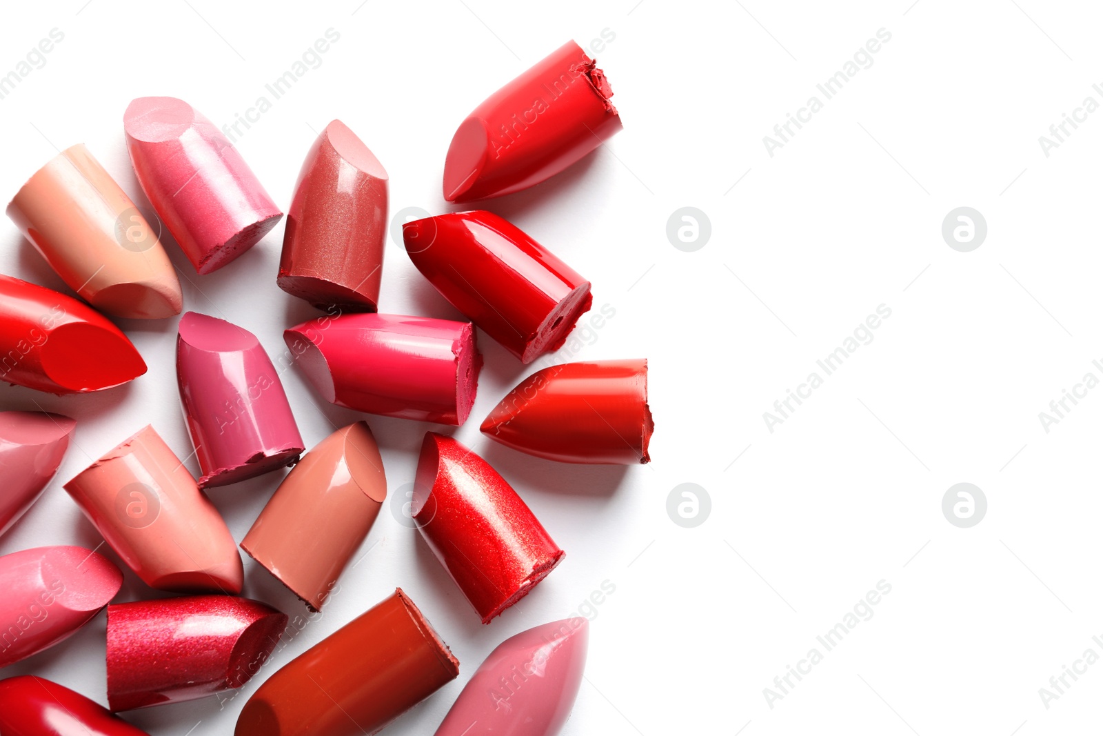 Photo of Collection of lipsticks on white background, top view