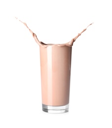 Glass with splashing chocolate milk on white background. Dairy drink