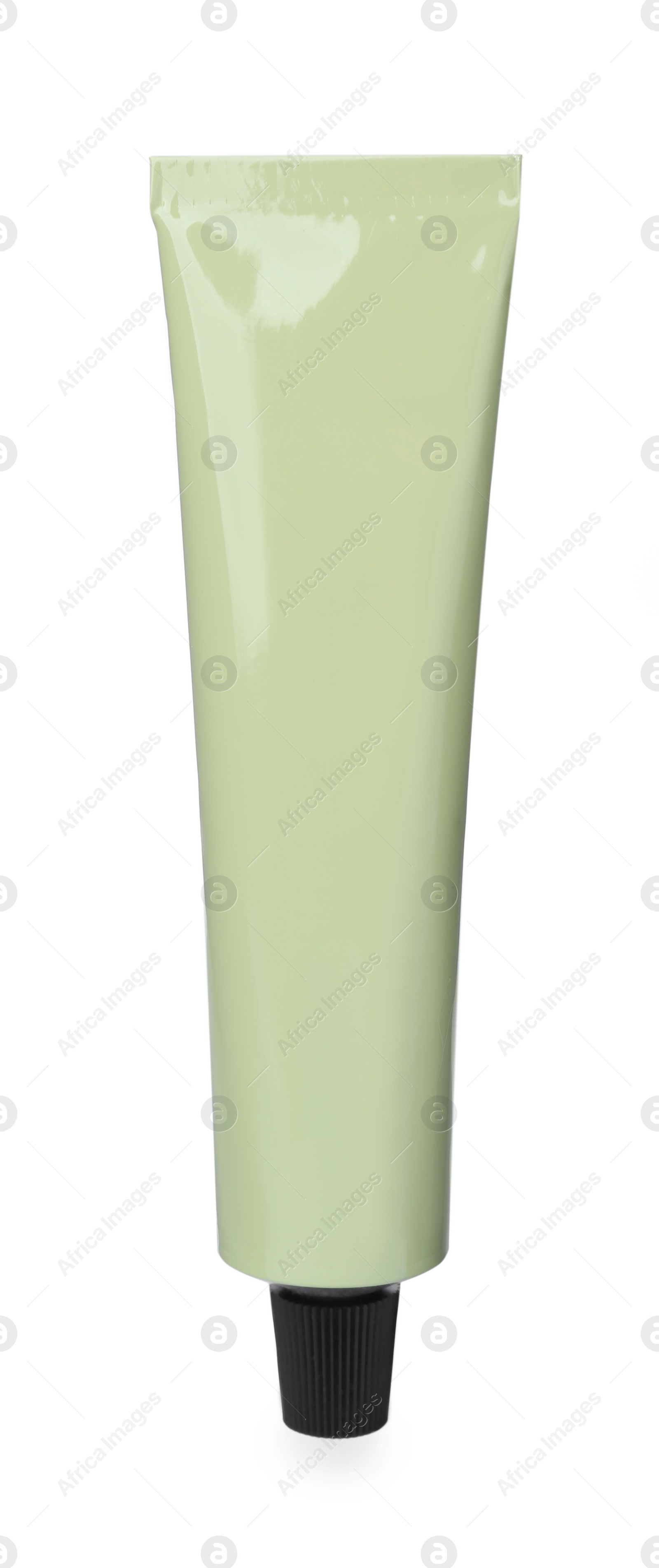 Photo of Pale green tube of hand cream isolated on white. Mockup for design