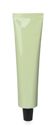 Photo of Pale green tube of hand cream isolated on white. Mockup for design