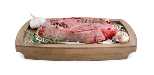 Photo of Wooden tray with piece of raw meat, garlic and thyme isolated on white