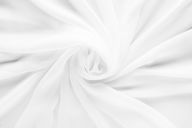 Image of Beautiful white tulle fabric as background, top view