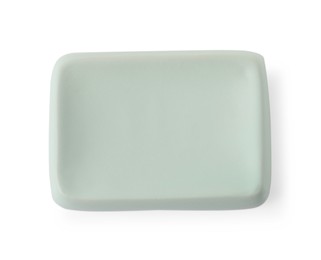 Photo of Bath accessory. Light green ceramic soap dish isolated on white, top view