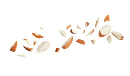 Pieces of tasty almonds on white background