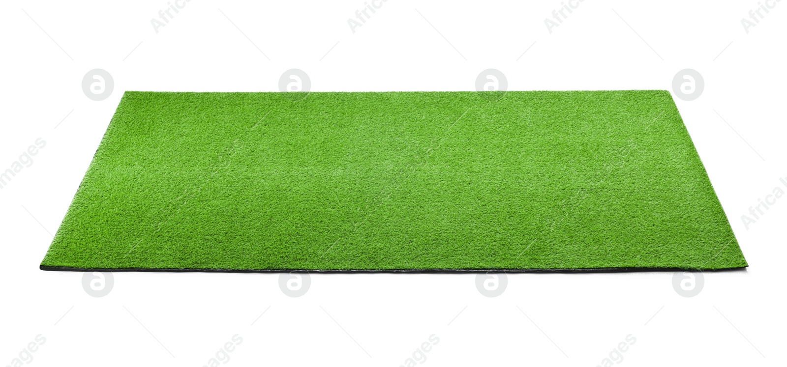 Photo of Green artificial grass carpet isolated on white