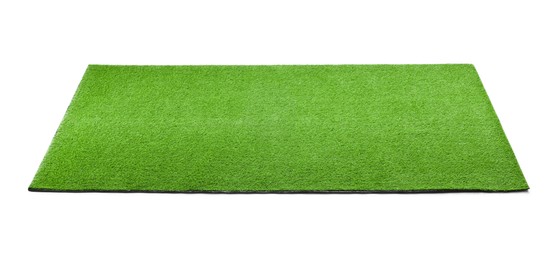 Photo of Green artificial grass carpet isolated on white