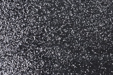 Photo of Shiny silver glitter as background, top view