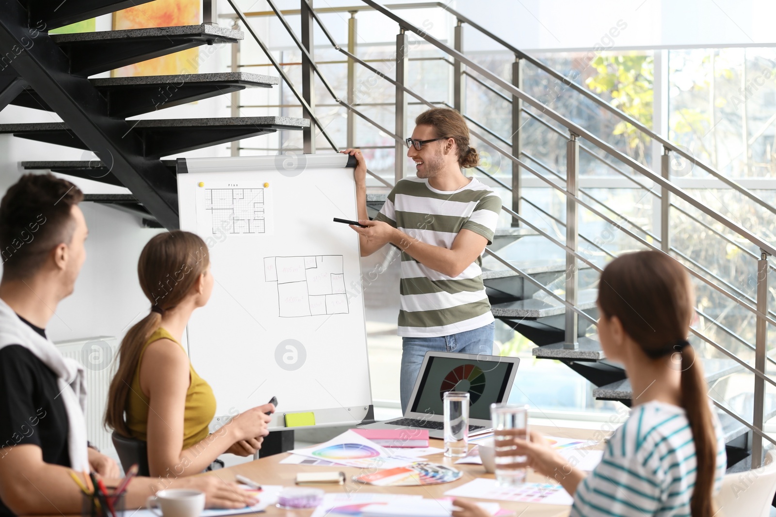 Photo of Professional team of interior designers  working in office