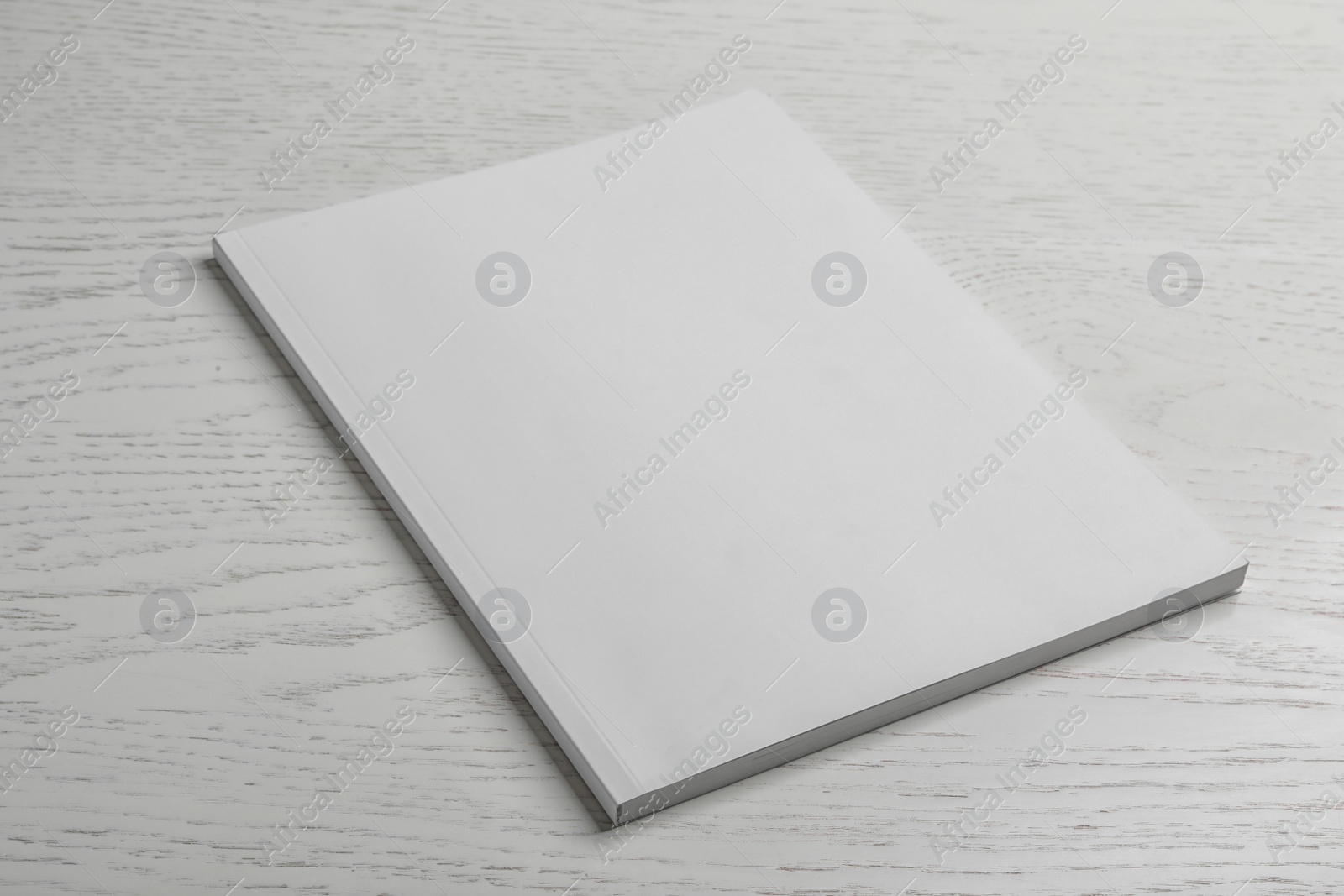 Photo of Brochure with blank cover on wooden background. Mock up for design