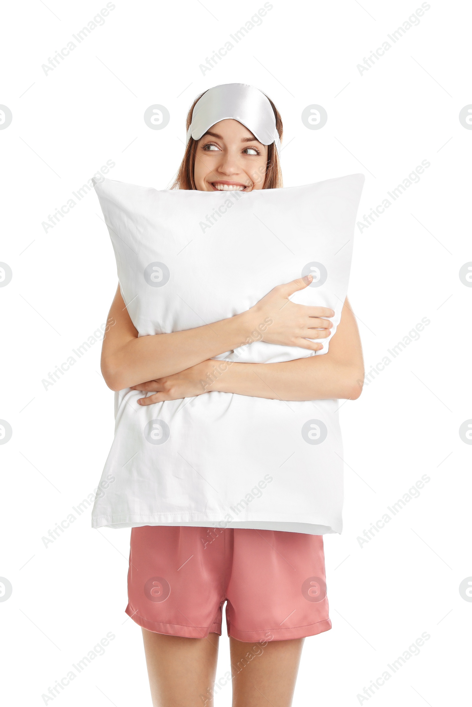 Photo of Beautiful woman with pillow and sleep mask on white background. Bedtime