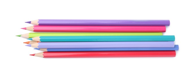 Photo of Pile of colorful wooden pencils on white background, top view