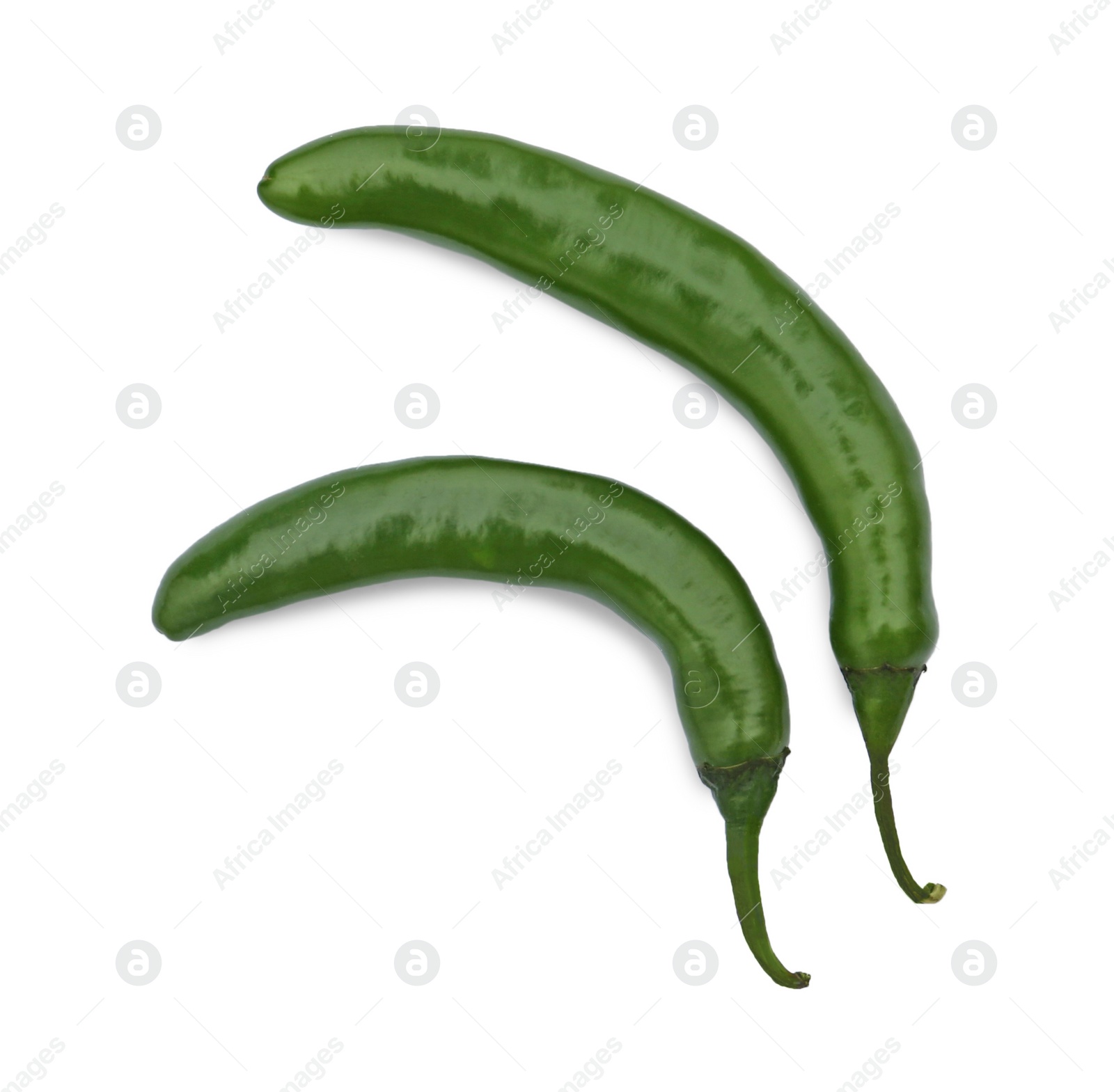 Photo of Green hot chili peppers on white background, top view