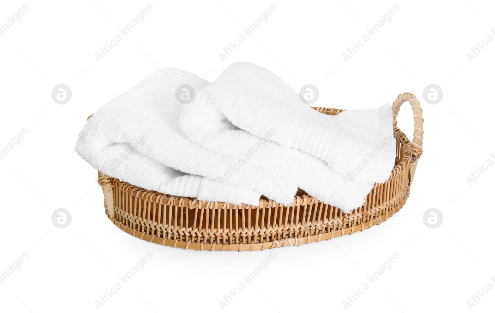 Photo of Terry towels in basket isolated on white