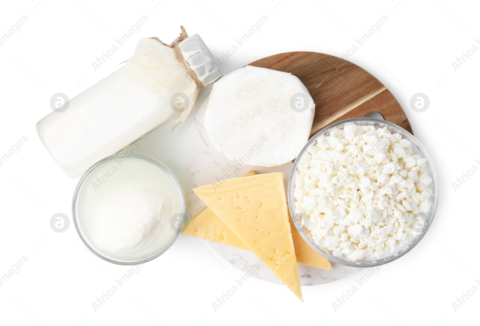 Photo of Different fresh dairy products isolated on white, top view